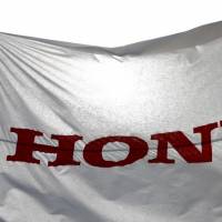 A flag with the company logo flies outside the Honda Motor Co. plant in Yorii, Saitama prefecture, Japan, March 8, 2016. Honda to open new XR-V factory in China in 2019