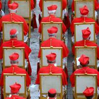 Cardinals are seen seated during a consistory held in St. Peter’s Square in the Vatican in March 2006. On Sunday Pope Francis named 17 new cardinals during an event in the same square. During Vatican event, Pope Francis promotes 17 prelates to cardinals, adding to potential successors