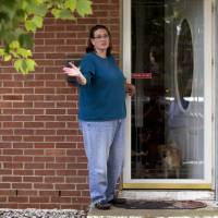 Debbie, the wife of Harold Thomas Martin III, talks to reporters outside of her home in Glen Burnie, Maryland, Wednesday. Her husband, a federal government contractor, is accused of stealing highly classified information. The Justice Department on Wednesday announced a criminal complaint against Harold Thomas Martin III. NSA contractor charged with taking classified intel