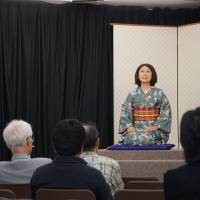 Tomomi Takeshima, whose stage name is Hotaru, performs rakugo in English at the Oedo Ryogokutei in Tokyo’s Sumida Ward last month. 'Rakugo' comedy no joke for students keen to hone English skills