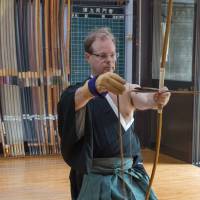 Lessons in life: Jerome Chouchan, the president of Godiva for Japan, South Korea, Australia and New Zealand, carefully prepares the alignment of his arrow at the Urakami Dojo in Tokyo’s Denenchofu district. As a fifth dan in Japanese archery, Chouchan is required to teach part time at the dojo. Godiva chief finds modern business lessons in the ancient art of the bow