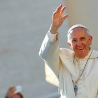 Pope Francis waves as he arrives to lead a special Jubilee audience in St. Peter’s square at the Vatican on Saturday. The Vatican announced in July that a papal visit to Japan is being considered for next summer. Japan's Filipinos heed Pope Francis' call to action on refugees and climate