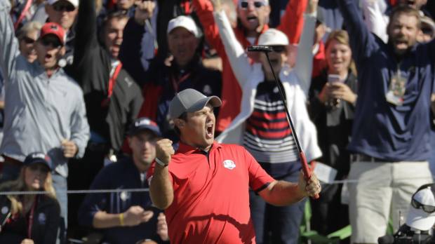 Patrick Reed of the United States reacts after making a putt and winning his match 3 and 2 on the 16th hole during a foursomes match at the Ryder Cup in Chaska, Minnesota, on Friday. U.S. races to lead in Ryder Cup