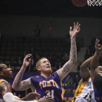 Former Tokyo Apache center Robert Swift, seen in a 2011 file photo, is seeking to relaunch his pro career in the NBA Development League. Swift's comeback bid continues with tryout