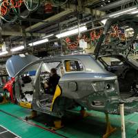 A man works on the production line at the Toyota factory in Derby, England, in March 2011. Doubts remain over Japanese automakers' plans after British exit