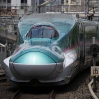 An East Japan Railway Co. (JR East) E5 series Shinkansen bullet train departs from Tokyo Station in Tokyo in May 2015. Abe eyes India to cement high-speed rail dominance over China