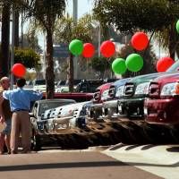 Toyota pickup trucks are displayed at a dealership in San Diego. Toyota agrees to $3.4 billion settlement over rust complaints
