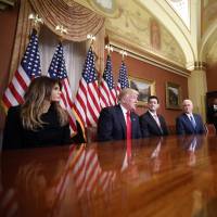 President-elect Donald Trump, wife Melania, Vice President-elect Mike Pence and House Speaker Paul Ryan, speak with reporters after their meeting on Capitol Hill in Washington on Thursday. Trump's business empire poses unprecedented potential conflicts of interest