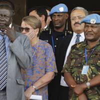 In this photo taken Sept. 2, United Nations Mission in South Sudan (UNMISS) force commander Lt. Gen. Johnson Mogoa Kimani Ondieki of Kenya (right) stands next to Ellen Loj, Special Representative of the U.N. Secretary-General, and an unidentified member of South Sudan’s government as they await a delegation of U.N. Security Council members, in Juba. Kenya’s foreign affairs ministry said Wednesday that it is pulling out its 1,000 troops deployed to South Sudan as part of the U.N. peacekeeping mission after the U.N. secretary-general fired the force’s Kenyan commander. Kenya pulls peacekeepers from South Sudan after Ban sacks mission chief over failed attack response