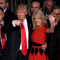 U.S. President-elect Donald Trump and his campaign manager, Kellyanne Conway, greet supporters during his election night rally in New York on Nov. 9. Top Trump adviser steps up bid to block possible Romney secretary of state nomination
