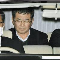 Hiroshi Kuramoto is taken to prosecutors Wednesday after being arrested by Osaka police the previous day on suspicion of taking bribes. Osaka professor held on bribery charges in connection with research on reinforced concrete