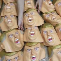Mug shot: Rubber masks depicting U.S. President-elect Donald Trump await finishing touches at the Ogawa Studio in Saitama on Tuesday. Ogawa Studio is working nonstop to catch up with a flood of orders for Trump masks since his election victory. Trump's lesson: You can lie your way to the very top