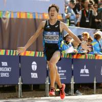 Hiroyuki Yamamoto crosses the finish line of the New York City Marathon on Sunday. Yamamoto finishes fourth in New York City Marathon