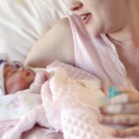 A mother holds her newborn baby at a hospital in Corpus Christi, Texas, in 2011. A study released Monday shows pregnancy affects not only a woman’s body: It changes parts of her brain structure too. Pregnancy causes women to lose gray matter but mental processes not hurt: study