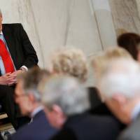 U.S. Senate Majority Leader Mitch McConnell (R-KY) participates in a ceremony to unveil a portrait honoring retiring Senate Minority Leader Harry Reid (D-NV) on Capitol Hill in Washington Thursday. House passes stopgap spending measure but Senate objections threaten U.S. shutdown Friday