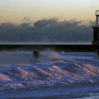 Steam rises up on the surface of Lake Michigan at sunrise Thursday in Chicago. Dangerously cold temperatures gripped the Upper Midwest in advance of a storm that’s expected to bring several inches of snow in coming days, while schools and officials in the Northeast braced for their own blast of wintry weather. Dangerously cold blow off North Pole plunging East Coast into deep freeze