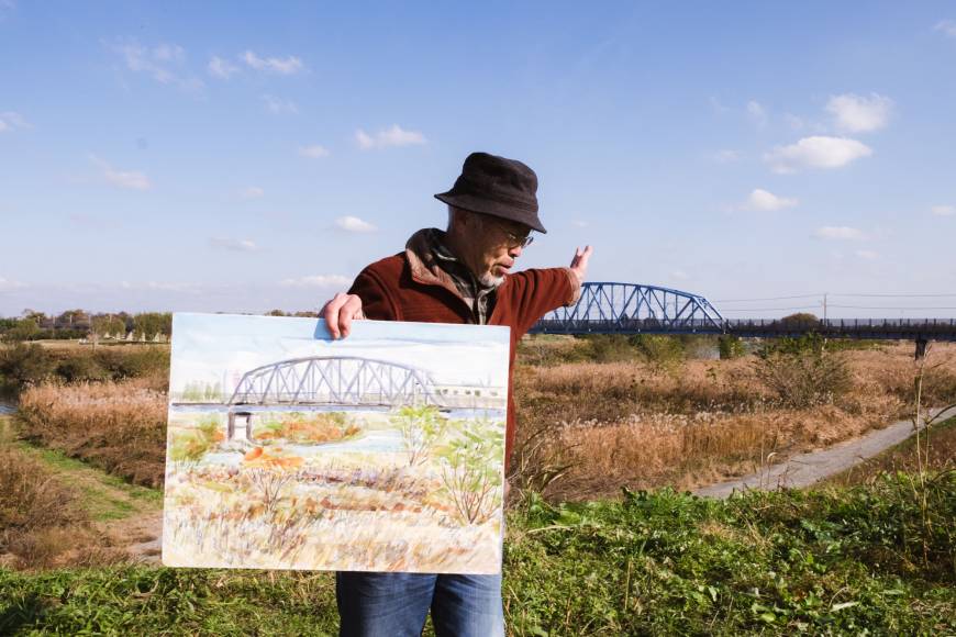Painted landscape: Toshiyuki Hakuno displays his watercolor of a bridge along the Arakawa River. LANCE HENDERSTEIN
