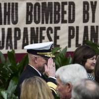 Paying respects: Adm. Chip Miller, former commanding officer of the USS George H.W. Bush, salutes World War II veterans arriving for a commemoration of the 75th anniversary of Pearl Harbor. Prime Minister Shinzo Abe will visit Pearl Harbor this week in a gesture of contrition that will reciprocate President Barack Obama’s visit to Hiroshima earlier in the year. Is Abe the wrong messenger for Pearl Harbor?