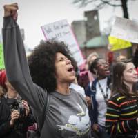 Mariah Parker chants during the Athens Women’s March at the Athena statue in downtown Athens, Georgia, Saturday. Roughly 700 people attended the march to pressure President Trump to not roll back women’s rights such as access to health care, abortions and equal pay, according to organizers. 'Whims' of U.S. politics: Deadly Third World backstreet abortions to rise as Trump reinstates NGO gag rule