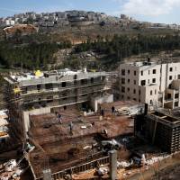 A general view shows the Israeli settlements of Ramot (foreground) and Ramat Shlomo (background) in an area of the occupied West Bank that Israel annexed to Jerusalem on Sunday. Israel plans 2,500 more settler homes in huge expansion in Trump-linked enclave as two-state solution fades
