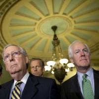 Senate Majority Leader Mitch McConnell, accompanied by Sen. John Barrasso (left), Sen. John Thune (center background) and Senate Majority Whip John Cornyn, attend a news conference on Capitol Hill in June. GOP embarks on Obamacare repeal with no replacement in sight