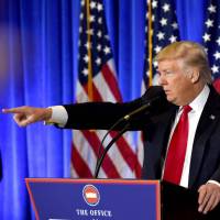 U.S. President-elect Donald Trump speaks during a press conference Thursday at Trump Tower in New York. Trump held his first news conference in nearly six months Wednesday, amid explosive allegations over his ties to Russia. Trump blames U.S. intelligence for 'phony' Russia dossier