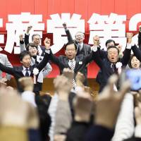 Japanese Communist Party leader Kazuo Shii (center) appears on stage Sunday during the party’s convention in Atami, Shizuoka Prefecture, together with the leaders of three other opposition parties. JCP chief vows not to roll back opposition tie-up before next general election