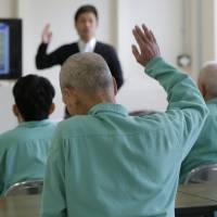 Aging problem: An elderly inmate raises his hand as he listens to a lecture at Sasebo Prison in Sasebo, Nagasaki Prefecture, in March 2015. Media starts to focus on Japan's aging prison population