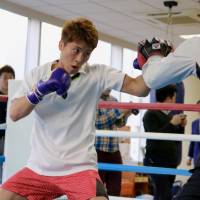 WBO super flyweight champion Naoya Inoue punches mitts his father and trainer Shingo Inoue hold at Ohashi Gym on Thursday. Inoue ready to ascend on global boxing scene