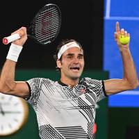 Roger Federer celebrates after beating Rafael Nadal 6-4, 3-6, 6-1, 3-6, 6-3 in the final of the Australian Open in Melbourne on Sunday. Federer beats Nadal in Australian Open final to win 18th major