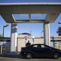 A customer refuels a Toyota Mirai hydrogen fuel cell vehicle at the UC Irvine Hydrogen Fueling Station, operated by the National Fuel Cell Research Center, in Irvine, California, on Feb. 4. Shell to build California fueling stations to remain in step with Toyota's hydrogen program