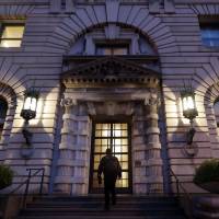A man walks up the steps of the 9th U.S. Circuit Court of Appeals building in San Francisco on Thursday. Appeals court tells Trump it won't back down