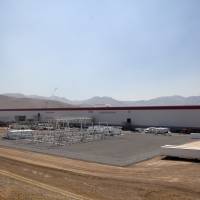 The Tesla Motor Inc. Gigafactory undergoes construction in Sparks, Nevada, last July. Lead by Tesla, battery storage facilities look to boot fossil fuels from the grid
