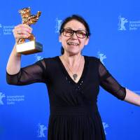 Director Ildiko Enyedi receives the Golden Bear for best film for her movie ‘On Body and Soul’ at the 67th Berlinal International Film Festival in Berlin on Saturday. Hungarian slaughterhouse love story wins Berlin film fest's Golden Bear