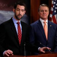U.S. Sens. Tom Cotton (left) and David Perdue unveil legislation aimed at curbing legal immigration by halving the number of legal immigrants admitted into the United States, at the U.S. Capitol in Washington Tuesday. GOP pair push bill to halve legal U.S. immigration as DHS chief backpedals on sanctuary cities