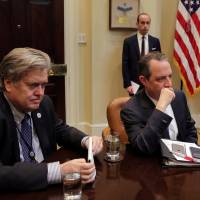 White House Chief Strategist Stephen Bannon (left), White House Chief of Staff Reince Priebus (right) and Senior advisor Stephen Miller attend a meeting between U.S. President Donald Trump and congressional leaders to discuss trade deals in the Roosevelt room of the White House in Washington Thursday. Congress scraps Obama-era rules on coal mining, guns