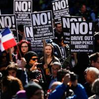 People take part in an “Not My President’s Day” rally in Manhattan, New York, Monday. 'Not My Presidents Day' as thousands rally in NYC, other cities against Trump
