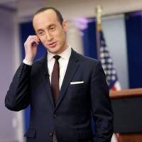 Senior White House Adviser Stephen Miller waits to go on the air in the White House Briefing Room in Washington Sunday. White House defends travel ban, deportation spree, may issue new immigration order