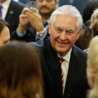 U.S. Secretary of State Rex Tillerson greets employees upon arrival at the State Department in Washington on Feb. 2. Trump ramps up efforts to reassure Japan with phone call from new top U.S. diplomat