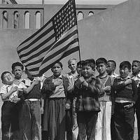 Japanese-American children pledge allegiance to the American flag in a photo taken on April 20, 1942, in San Francisco before their internment. Trump immigration policies deja vu for descendants of WWII internees