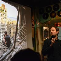 Road to ruin: Michael Gakuran shows photos from the man-made island of Hashima, aka Gunkanjima, off Nagasaki at last month’s Nerd Nite. 'Otaku' gather to celebrate the obsessive at Nerd Nite Tokyo