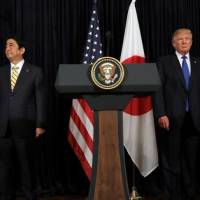 U.S. President Donald Trump and Japanese Prime Minister Shinzo Abe leave after delivering remarks on North Korea at Trump’s Mar-a-Lago club in Palm Beach, Florida. Abe walks a fine line between Trump and Asia