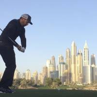 Sergio Garcia tees off on the eighth hole during the second-round completion of the Dubai Desert Classic on Saturday. Garcia takes three-shot lead at Dubai Desert Classic