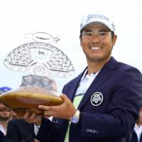 Hideki Matsuyama holds the trophy after capturing the title at the Waste Management Phoenix Open on Sunday. Matsuyama wins playoff to repeat as Phoenix Open champion