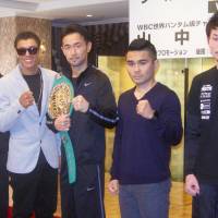 WBC bantamweight champion Shinsuke Yamanaka (third from left), Carlos Carlson (second from the left) and other boxers on the undercard of Thursday’s world-title bout pose for a photo at a Tokyo hotel on Tuesday. Challenger Carlson, champion Yamanaka express confidence ahead of WBC bantamweight title bout