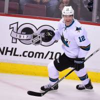 San Jose’s Patrick Marleau celebrates after scoring his 500th NHL goal against Vancouver on Thursday. The Sharks defeated the Canucks 4-1. Sharks' Marleau notches 500th career goal