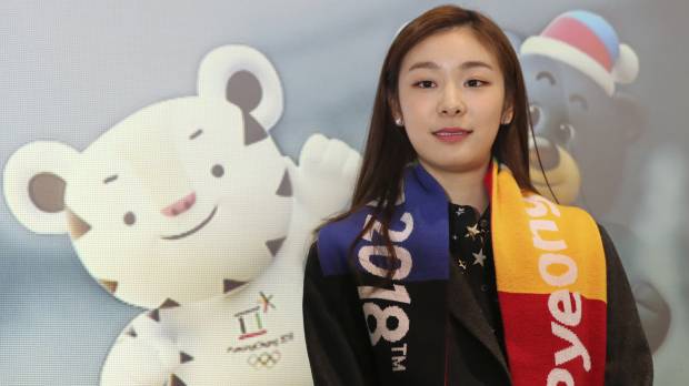 Olympic figure skating gold medalist Yuna Kim, an honorary ambassador for the 2018 Winter Olympics, poses for a photo during a ticket sales launch event for the Pyeongchang Games in Gangneung, South Korea, on Thursday. Yuna Kim unveils Olympic torch