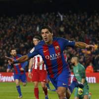 Barcelona’s Luis Suarez celebrates after scoring against Atletico during the second leg of their Copa del Rey semifinal on Tuesday. Messi, Suarez send Barca to Copa final