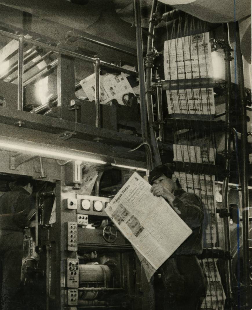 A printing section worker checks a copy of The Japan Times in a photo dated May 3, 1966.