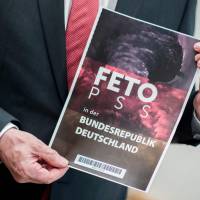 Lower Saxony Interior Minister Boris Pistorius holds the cover of a list with the names of alleged supporters of the Gulen movement that was handed over to Germany’s Federal Intelligence Service (Bundesnachrichtendienst) by representatives of the Turkish intelligence service, during a press conference in Hanover, central Germany, on Tuesday. Pistorius accused Turkey of carrying out “unacceptable” spying on alleged sympathizers of the movement led by exiled preacher Fethullah Gulen, blamed for a failed coup last year. German officials warn Gulen followers Turkey is trying to spy on them